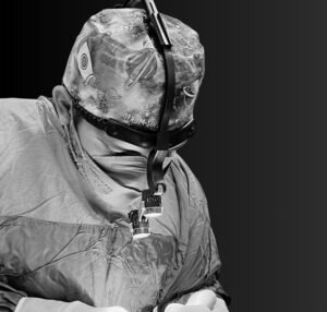 Op. Dr. Berkay Caytemel performing surgery in the operating room